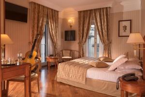 Postel nebo postele na pokoji v ubytování Albergo Ottocento