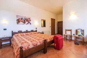 Voodi või voodid majutusasutuse Hotel Il Querceto toas