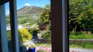 a view of a mountain from a window at The Old Coastguard Station in Cahersiveen