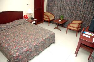 RNS Residency Sea View客房内的一张或多张床位