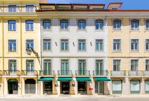 
a large building with two windows and a street sign at Vincci Baixa in Lisbon
