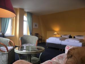 En eller flere senger på et rom på Hotel Schweriner Hof