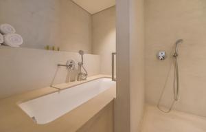 Koupelna v ubytování Bitzaro Grande Hotel & Suites