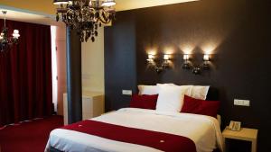 Katil atau katil-katil dalam bilik di Hotel Olivier