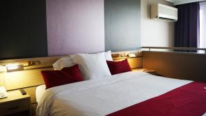 Katil atau katil-katil dalam bilik di Hotel Olivier
