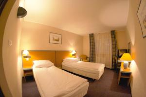 Postel nebo postele na pokoji v ubytování Hotel TenisHouse