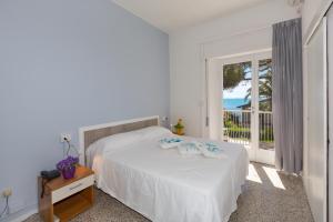 Postel nebo postele na pokoji v ubytování Hotel Costa Verde