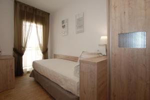 Giường trong phòng chung tại Apartments Gran VP