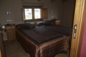 Un pat sau paturi într-o cameră la Mas Taniet Hotel Rural