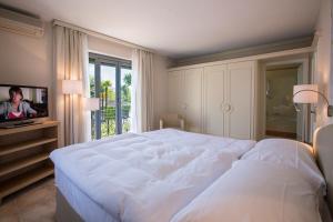 Postel nebo postele na pokoji v ubytování Villa Delta Suites House