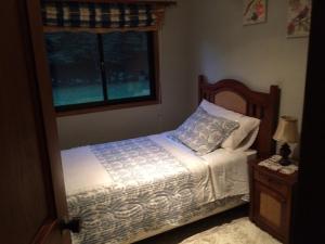 מיטה או מיטות בחדר ב-Casa Los Notros