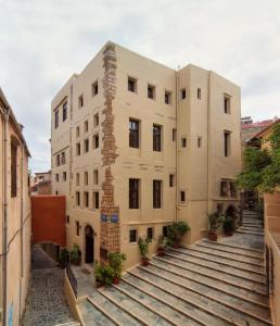 a building with stairs leading up to it at Porto Del Colombo Traditional Boutique Hotel in Chania