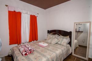 En eller flere senge i et værelse på Pousada Recanto Verde