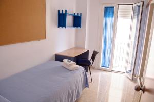 Postel nebo postele na pokoji v ubytování Residencia Universitaria Cadiz Centro