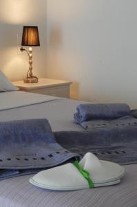 מיטה או מיטות בחדר ב-Lino Apartments