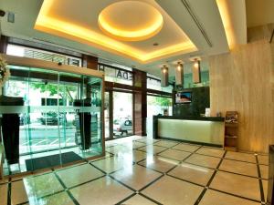 a lobby with a large glass door in a building at TURIM Alameda Hotel in Lisbon