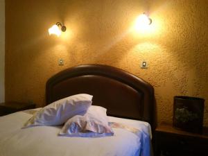 Postel nebo postele na pokoji v ubytování Hotel Polydrosos