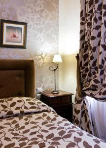 Postel nebo postele na pokoji v ubytování Hotel Polydrosos