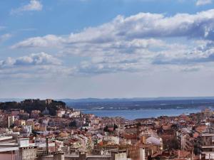a view of a city with the water and buildings at TURIM Alameda Hotel in Lisbon