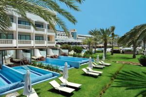 a view of the pool at the resort at Constantinou Bros Athena Beach Hotel in Paphos