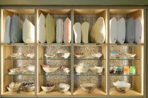 a display case filled with lots of surfboards at Kyoto Tower Hotel Annex in Kyoto