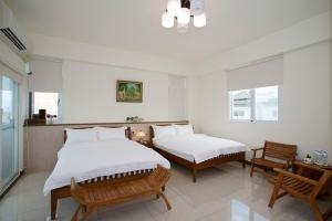 Postel nebo postele na pokoji v ubytování Taitung Matsunogien