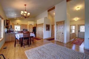 a kitchen and dining room with a table and chairs at Ridgetop Hideaway in Hatch