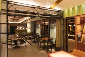 a restaurant with tables and chairs and a sign that reads restaurant return at Kyoto Tower Hotel Annex in Kyoto
