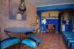 a dining room with a table and chairs at The Gomera Lounge in Valle Gran Rey