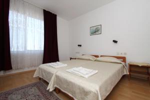 Postel nebo postele na pokoji v ubytování Family Hotel Verona