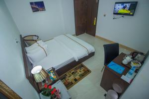 Postel nebo postele na pokoji v ubytování Hotel Progati Inn Ltd.