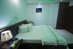 Postel nebo postele na pokoji v ubytování Hotel Progati Inn Ltd.