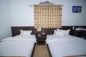 Postel nebo postele na pokoji v ubytování Hotel Progati Inn Ltd.