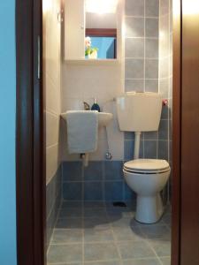 a bathroom with a toilet and a sink at Evgenia Maisonette in Ierissos +36 photos
