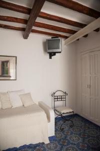 Televízia a/alebo spoločenská miestnosť v ubytovaní Casa Prete