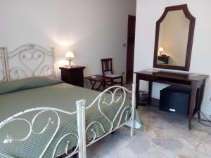 Posteľ alebo postele v izbe v ubytovaní Le Giare B&B