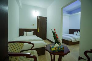 Postel nebo postele na pokoji v ubytování Hotel Progati Inn Ltd.