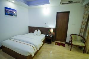 Postel nebo postele na pokoji v ubytování Hotel Progati Inn Ltd.