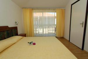 Postel nebo postele na pokoji v ubytování Family Hotel Verona