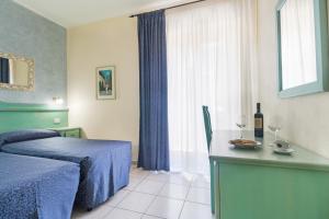Postel nebo postele na pokoji v ubytování Hotel San Francisco