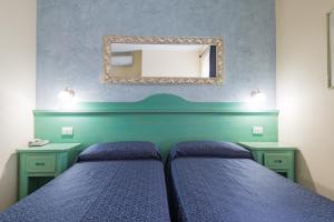 Postel nebo postele na pokoji v ubytování Hotel San Francisco