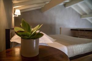 Postel nebo postele na pokoji v ubytování Talè Restaurant & Suite
