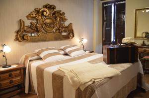 Кровать или кровати в номере Posada Real La Montañesa