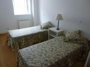 
Cama o camas de una habitación en Alojamientos Turisticos Montamarta
