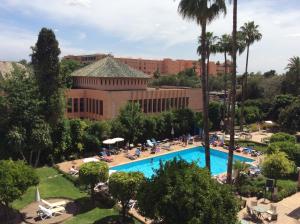 an overhead view of a resort with a swimming pool at Chems Hotel in Marrakesh