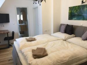 Łóżko lub łóżka w pokoju w obiekcie Enjoyit Rooms