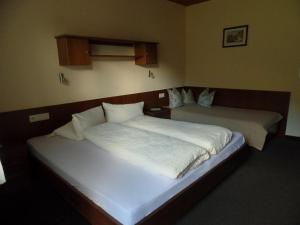 Postel nebo postele na pokoji v ubytování Haus Oblasser