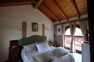 Postel nebo postele na pokoji v ubytování Cascina Bricco + 37 fotografií