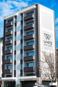 a building with the w white logo on it at White Luxury in Thessaloniki