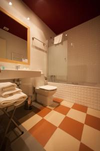 Ванна кімната в La Castellana - Habitaciones y desayuno